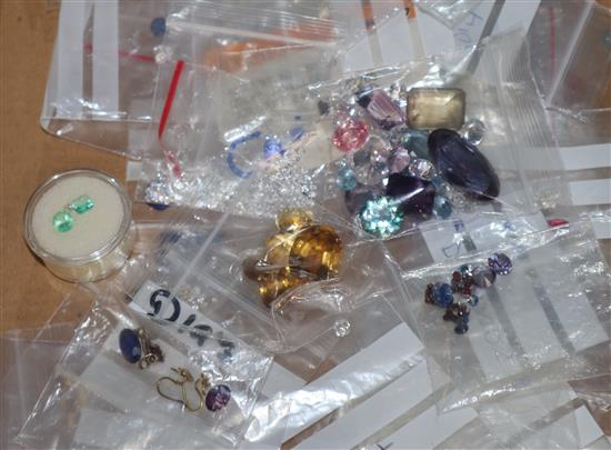 A group of assorted unmounted cut gemstones including diamonds, opals, cultured pearls and other coloured stones, etc.